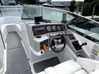 Slide: The Image of 2001 Formula 280 Bow Rider boat interior with steering wheel and dashboard controls. - 4