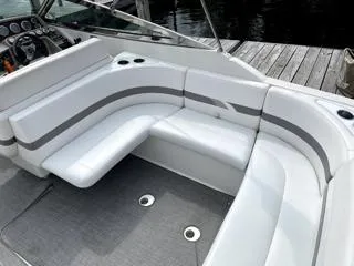 Slide: The Image of 2001 Formula 280 Bow Rider boat interior with white seating and dashboard. - 7