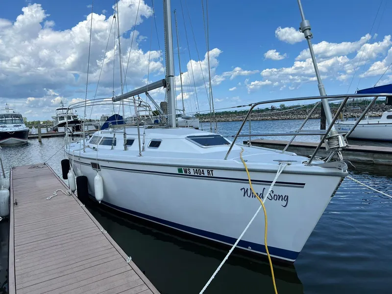 Slide: The Image of Catalina 320 sailboat docked at marina, 1995 model, named Wind Song. - 1
