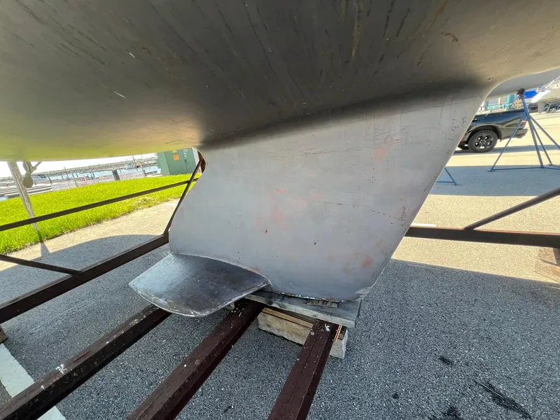 Slide: The Image of Catalina 320 sailboat keel, 1995 model, on a trailer for maintenance. - 15