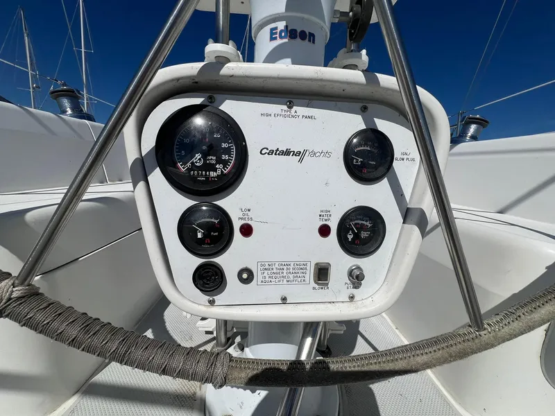 Slide: The Image of Control panel of a 1995 Catalina 320 sailboat with gauges and dials. - 25