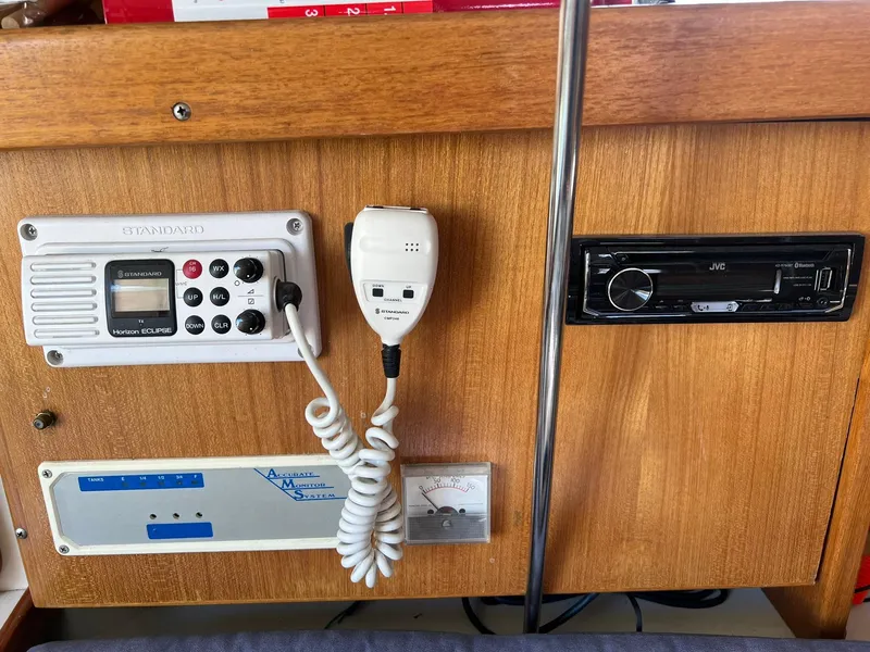 Slide: The Image of Control panel of a 1995 Catalina 320 sailboat with radio and navigation equipment. - 34