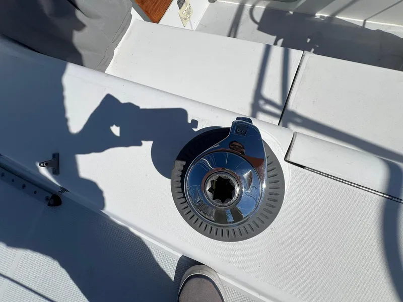 Slide: The Image of Catalina 320 1995 sailboat deck with winch and shadow. - 45