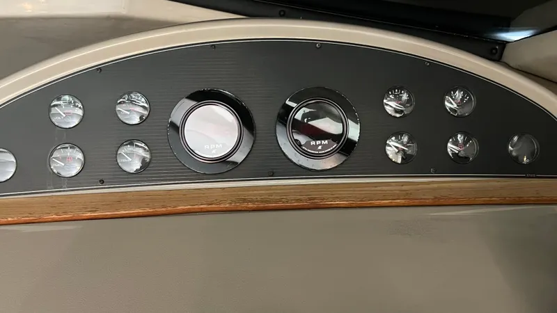 Slide: The Image of Dashboard of a 1999 Bayliner 3988 Motoryacht with RPM and other gauges. - 30