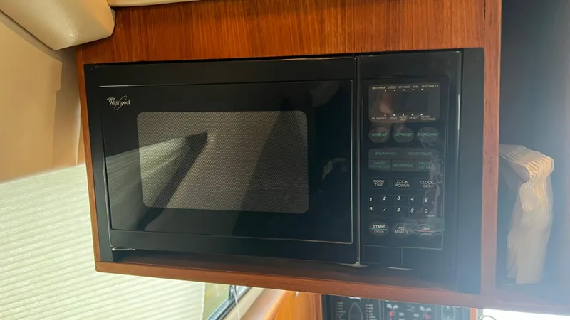 Slide: The Image of Whirlpool microwave inside 1999 Bayliner 3988 Motoryacht kitchen area. - 33