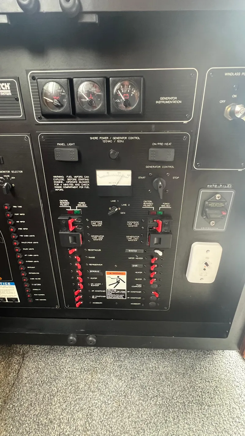 Slide: The Image of Control panel of a 1999 Bayliner 3988 Motoryacht with gauges and switches. - 34