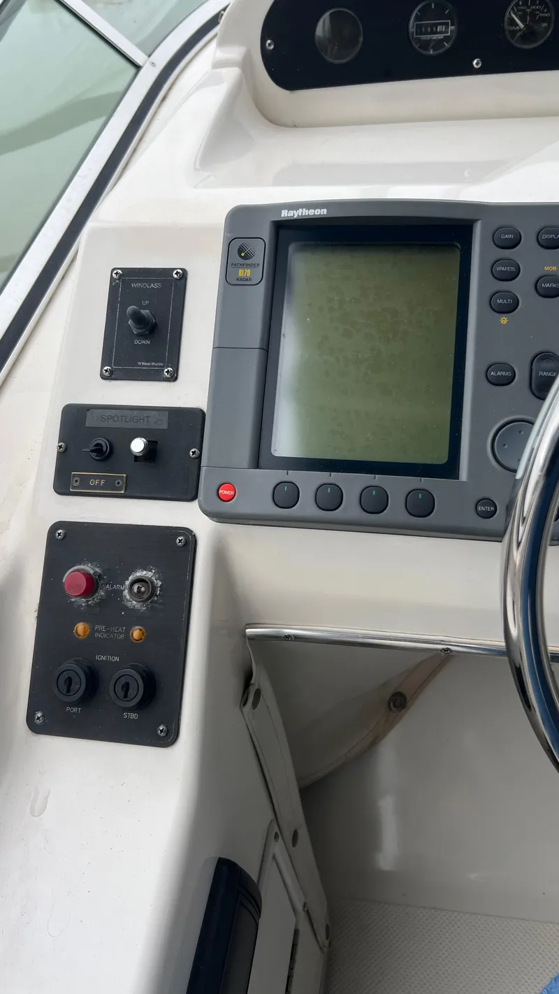 Slide: The Image of 1999 Bayliner 3988 Motoryacht dashboard with navigation controls and display. - 37
