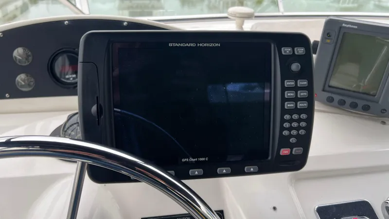 Slide: The Image of 1999 Bayliner 3988 Motoryacht helm with Standard Horizon GPS and Raytheon display. - 39
