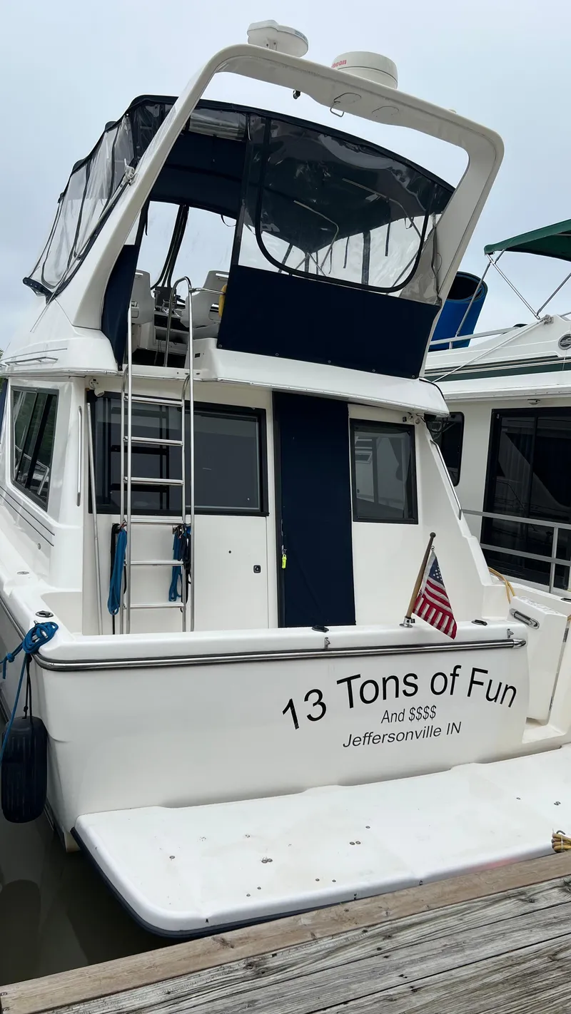 Slide: The Image of 1999 Bayliner 3988 Motoryacht docked, named "13 Tons of Fun," Jeffersonville, IN. - 4