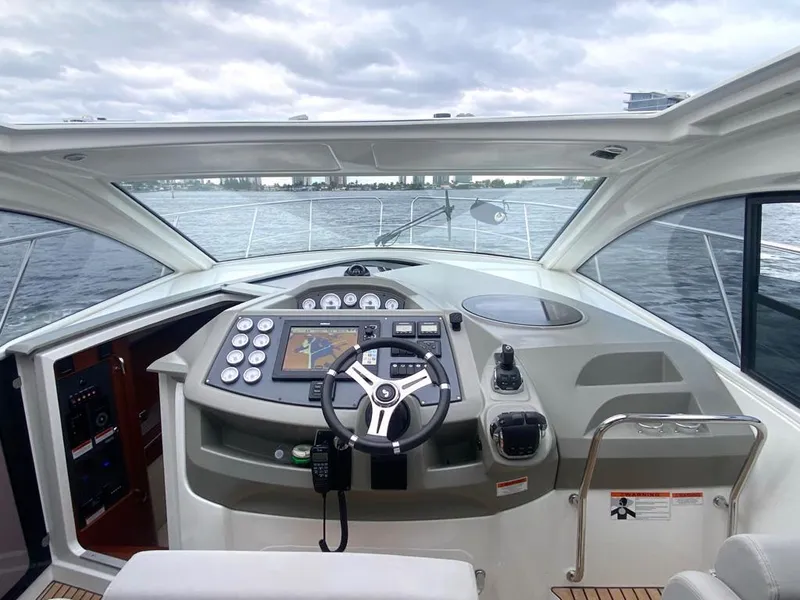 Slide: The Image of 2014 Beneteau 38 yacht cockpit with modern navigation system and steering wheel. - 10