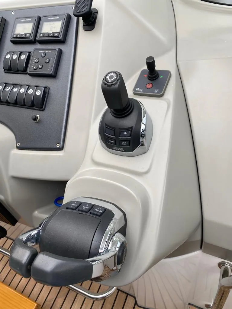 Slide: The Image of Control panel of a 2014 Beneteau 38 yacht with joystick and throttle. - 11