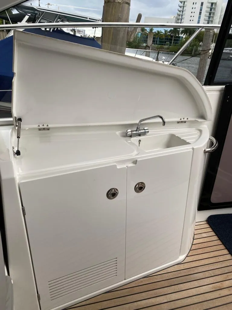 Slide: The Image of Beneteau 38 2014 model yacht sink and storage area on deck. - 20