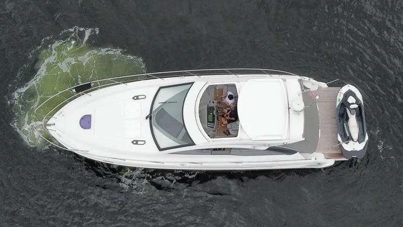Slide: The Image of Aerial view of a 2014 Beneteau 38 yacht cruising on water. - 3