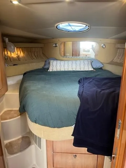 Slide: The Image of Cozy cabin interior of 2003 Regal 3860 Commodore yacht with bed and porthole. - 12