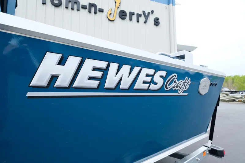 Slide: The Image of 2024 Hewescraft 220 Ocean Pro boat in blue at Tom-n-Jerry's dealership. - 17