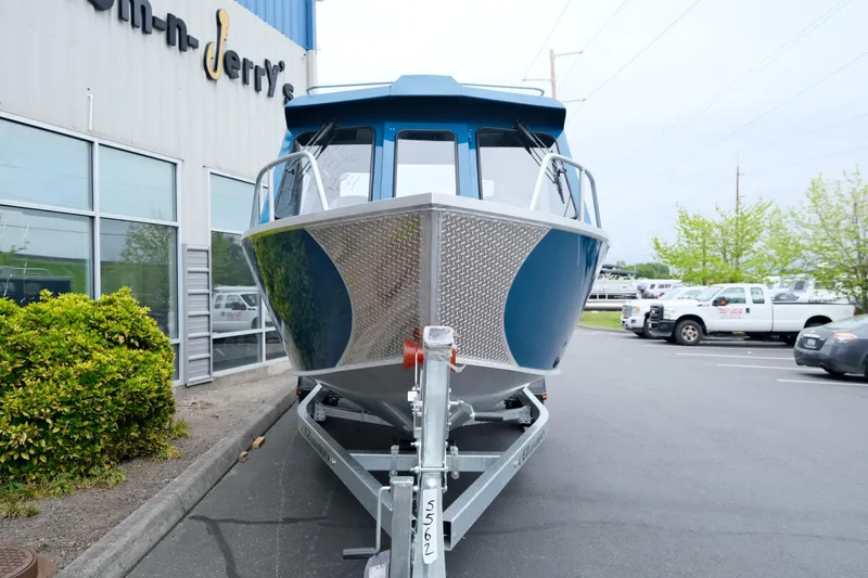 Slide: The Image of 2024 Hewescraft 220 Ocean Pro boat on trailer outside dealership. - 3