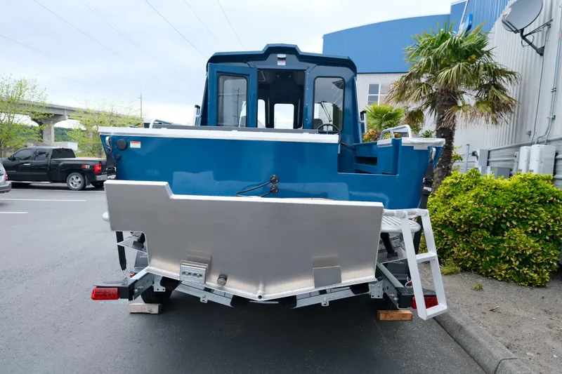 Slide: The Image of 2024 Hewescraft 220 Ocean Pro boat, rear view, parked outdoors. - 5