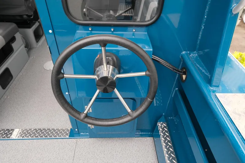 Slide: The Image of 2024 Hewescraft 220 Ocean Pro steering wheel and dashboard, blue interior. - 8
