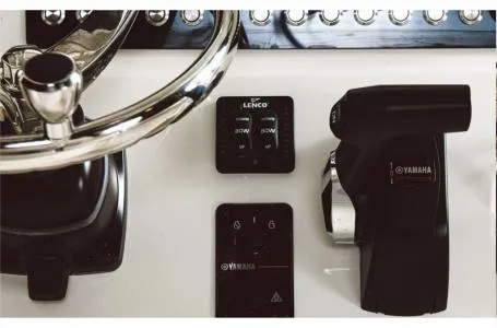 Slide: The Image of 2024 Key West 219 FS boat dashboard with Yamaha controls and Lenco trim tabs. - 15