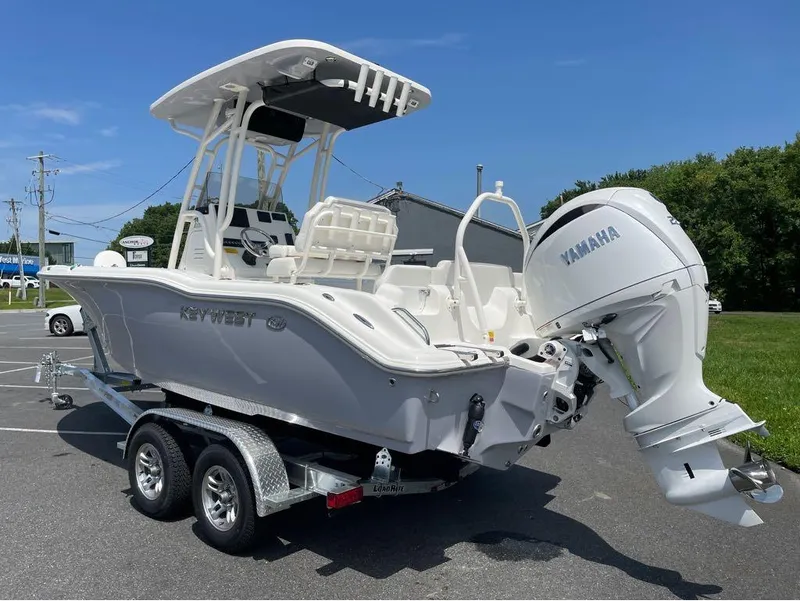 Slide: The Image of 2024 Key West 219 FS boat with Yamaha outboard motor on trailer. - 20