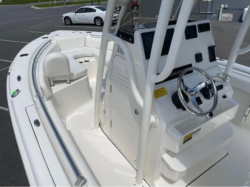Slide: The Image of 2024 Key West 219 FS boat interior with steering console and seating. - 21