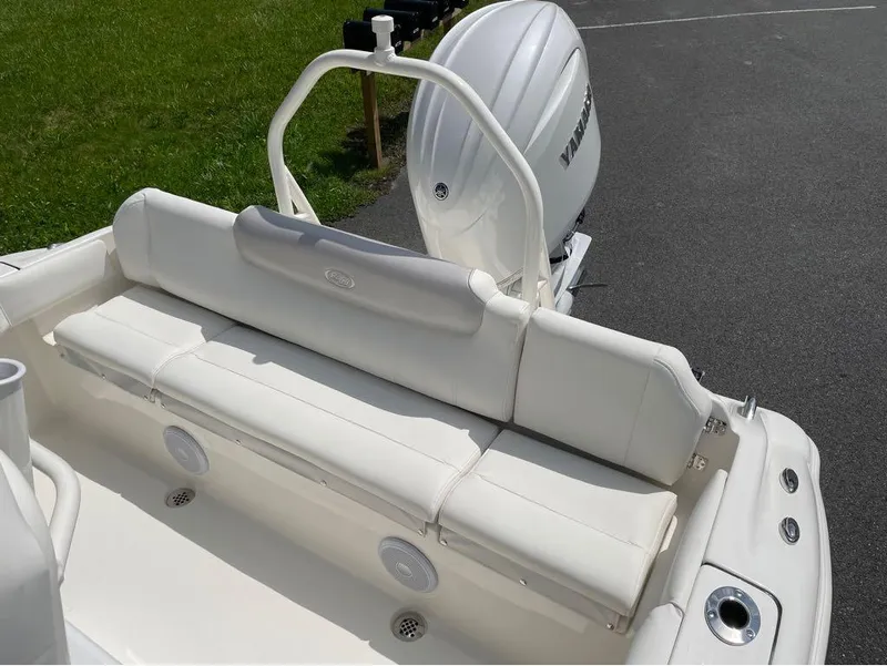 Slide: The Image of 2024 Key West 219 FS boat with white seating and Yamaha outboard motor. - 24
