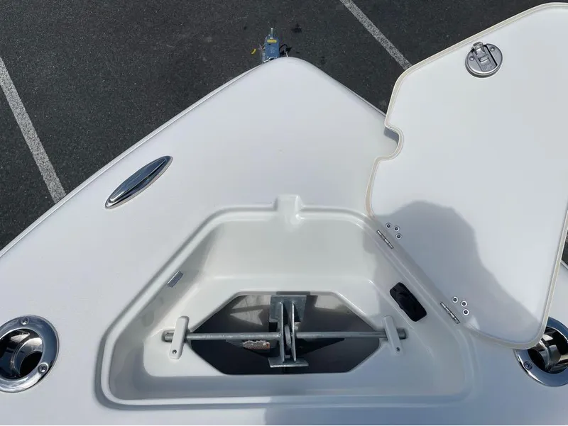 Slide: The Image of 2024 Key West 219 FS boat anchor compartment with open hatch. - 25
