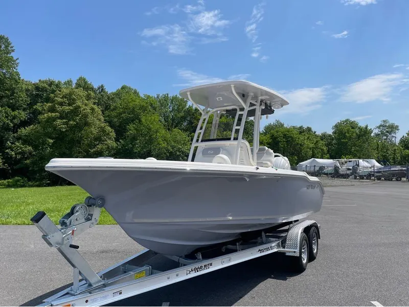 Slide: The Image of 2024 Key West 219 FS boat on a trailer in a parking lot. - 27