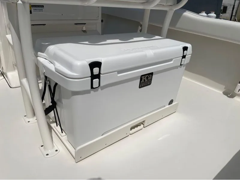 Slide: The Image of White K2 cooler on a 2024 Key West 219 FS boat deck. - 6