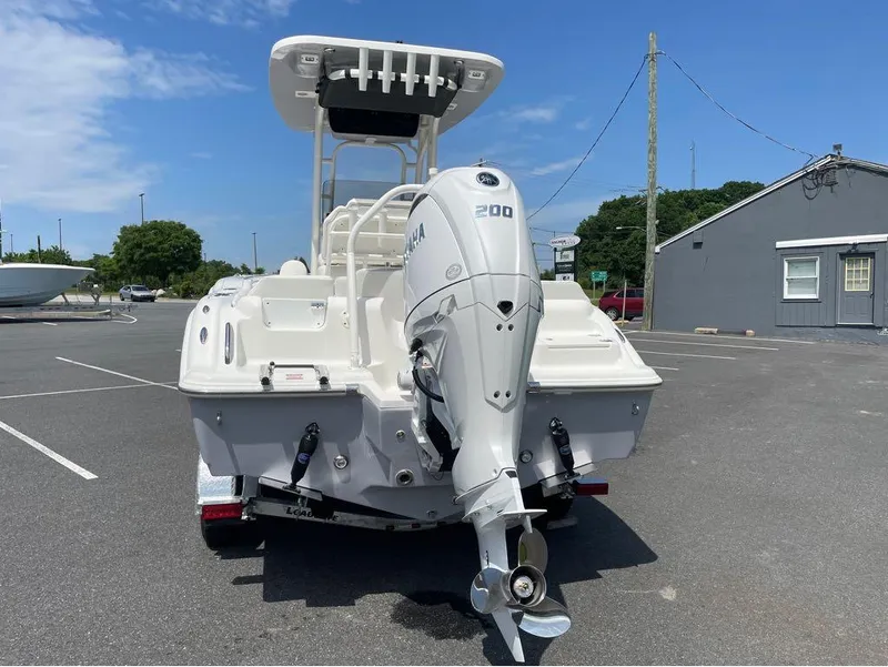 Slide: The Image of 2024 Key West 219 FS boat with Yamaha 200 outboard motor in parking lot. - 7