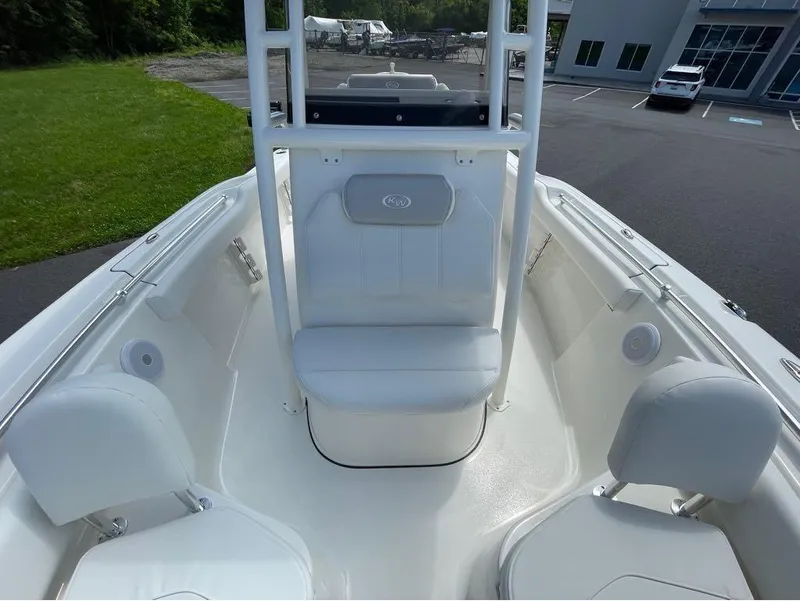 Slide: The Image of 2024 Key West 219 FS boat interior with white seating and clean design. - 8