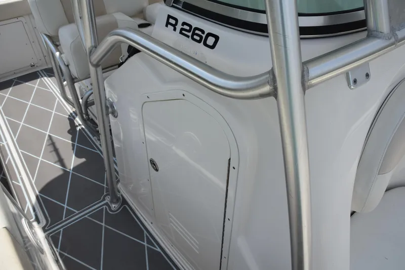 Slide: The Image of 2006 Robalo R260 Center Console boat interior with stainless steel railings. - 10