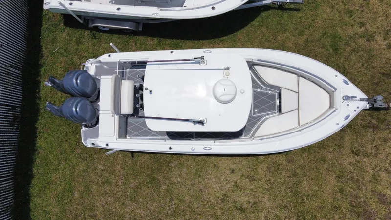 Slide: The Image of 2006 Robalo R260 Center Console boat, aerial view, twin engines, white exterior. - 18