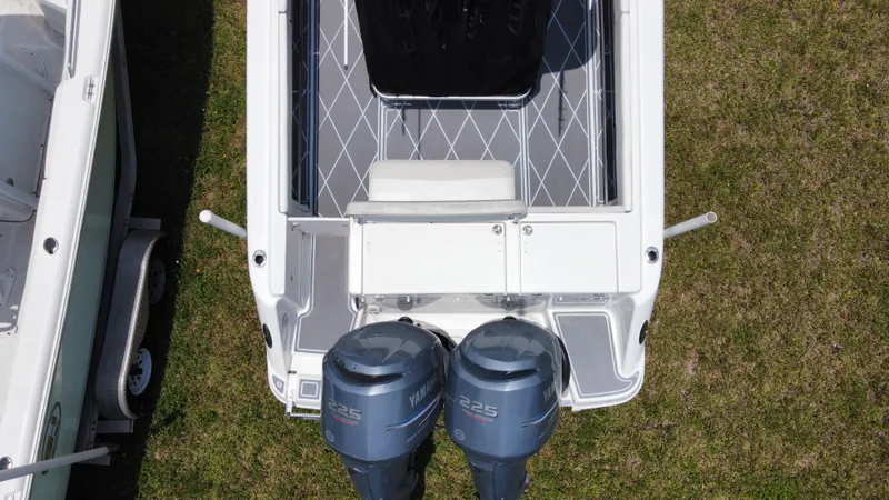 Slide: The Image of Top view of a 2006 Robalo R260 Center Console boat with twin Yamaha engines. - 21