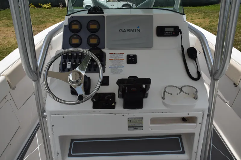 Slide: The Image of 2006 Robalo R260 Center Console boat helm with Garmin navigation system. - 25