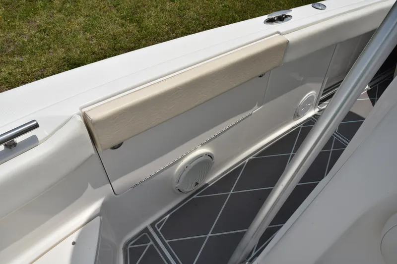 Slide: The Image of 2006 Robalo R260 Center Console boat interior with cushioned side panel and speaker. - 32