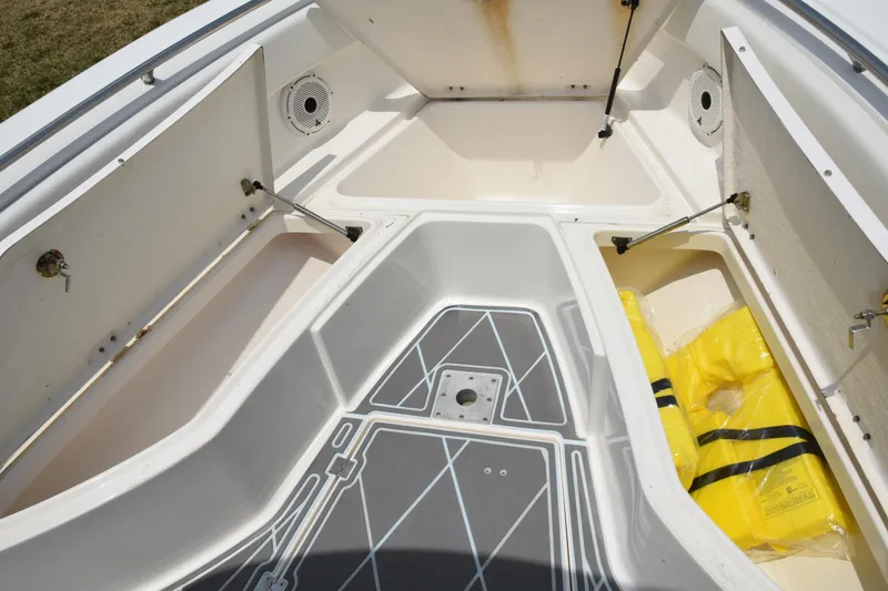 Slide: The Image of 2006 Robalo R260 Center Console boat storage compartments and deck. - 36