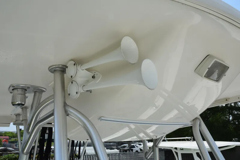 Slide: The Image of 2006 Robalo R260 Center Console boat with dual horns and T-top. - 37