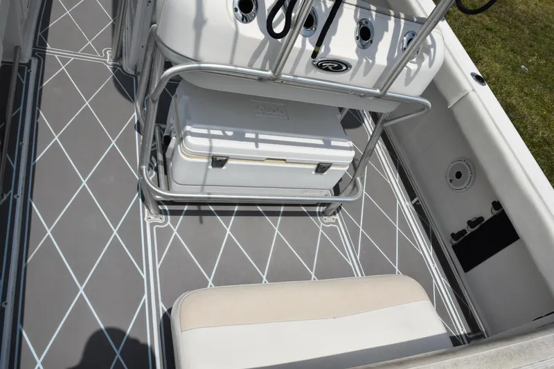 Slide: The Image of 2006 Robalo R260 Center Console boat deck with cooler and seating. - 42