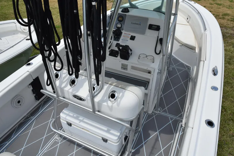 Slide: The Image of 2006 Robalo R260 Center Console boat interior with fishing rod holders and navigation equipment. - 43