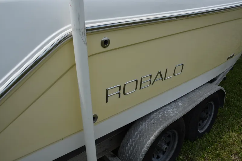 Slide: The Image of 2006 Robalo R260 Center Console boat on a trailer. - 5