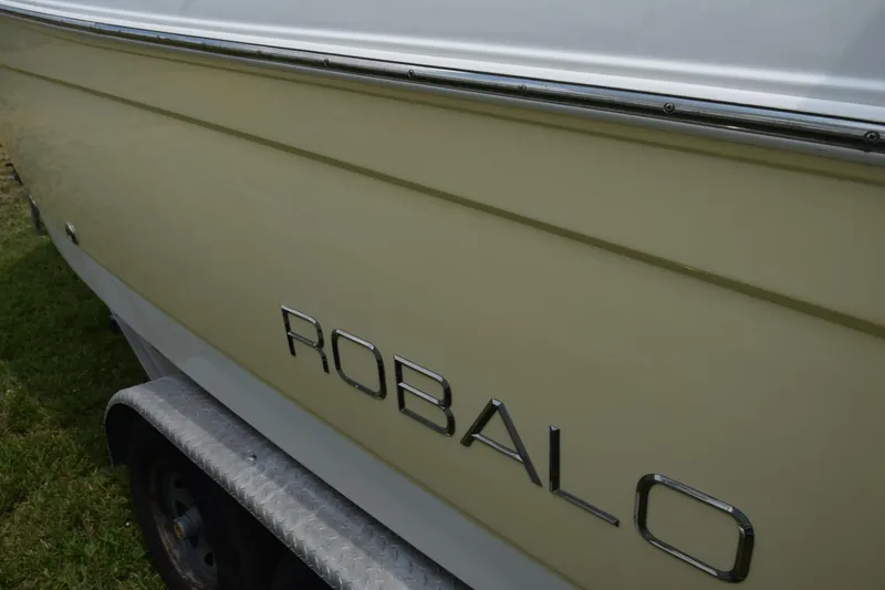 Slide: The Image of 2006 Robalo R260 Center Console boat side view with logo. - 6