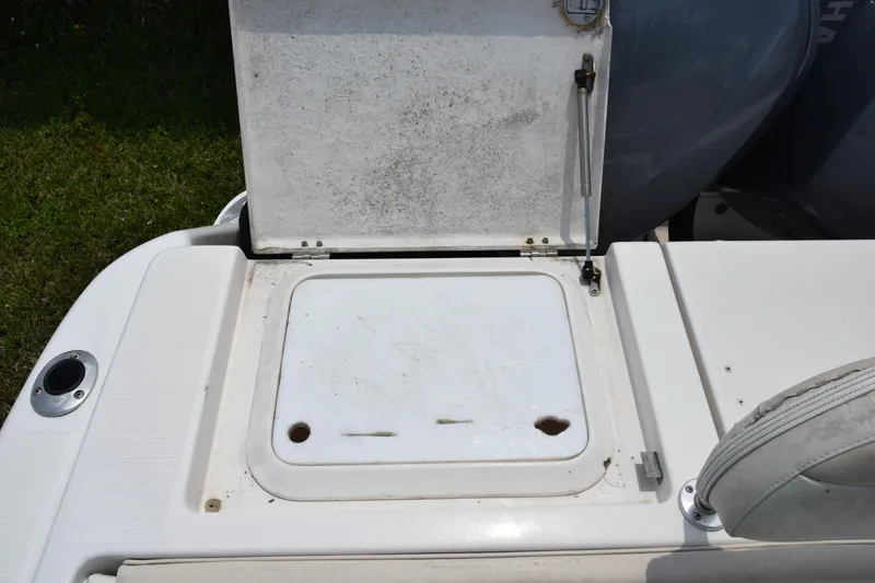 Slide: The Image of 2006 Robalo R260 Center Console storage compartment with open hatch. - 9