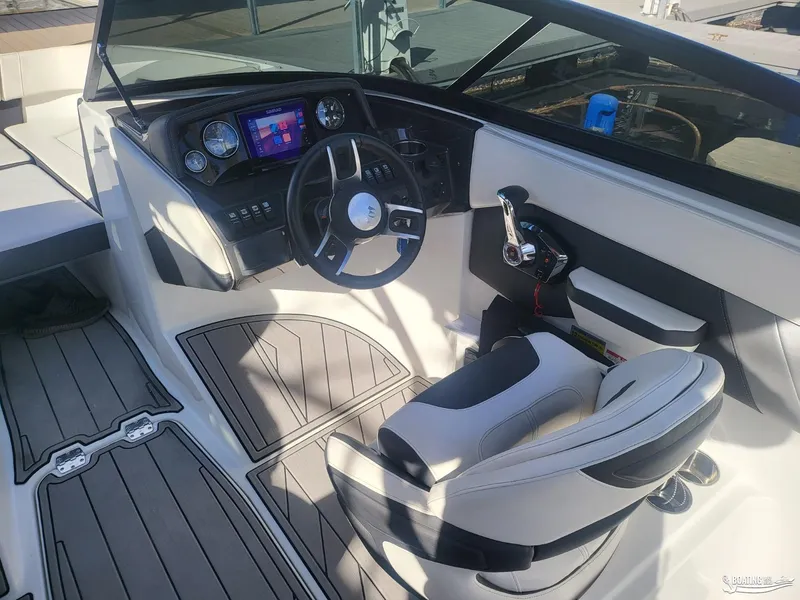 Slide: The Image of 2023 Monterey M22 boat cockpit with modern steering and control panel. - 23