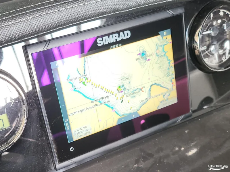 Slide: The Image of Simrad navigation display on 2023 Monterey M22 boat dashboard, showing a detailed map. - 24