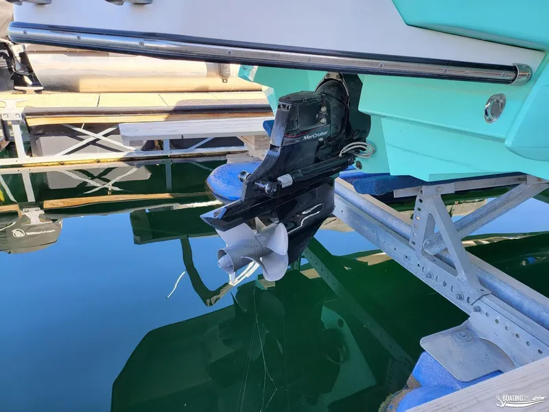 Slide: The Image of 2023 Monterey M22 boat with MerCruiser engine on a boat lift. - 33