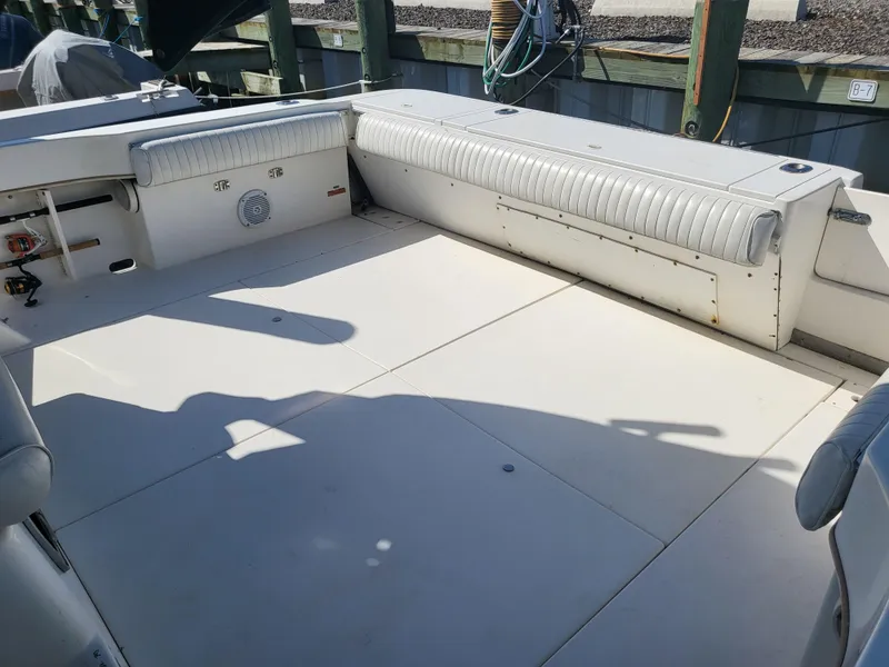 Slide: The Image of 1993 Sea Ray Laguna 29 Walkaround boat deck with seating and storage. - 2