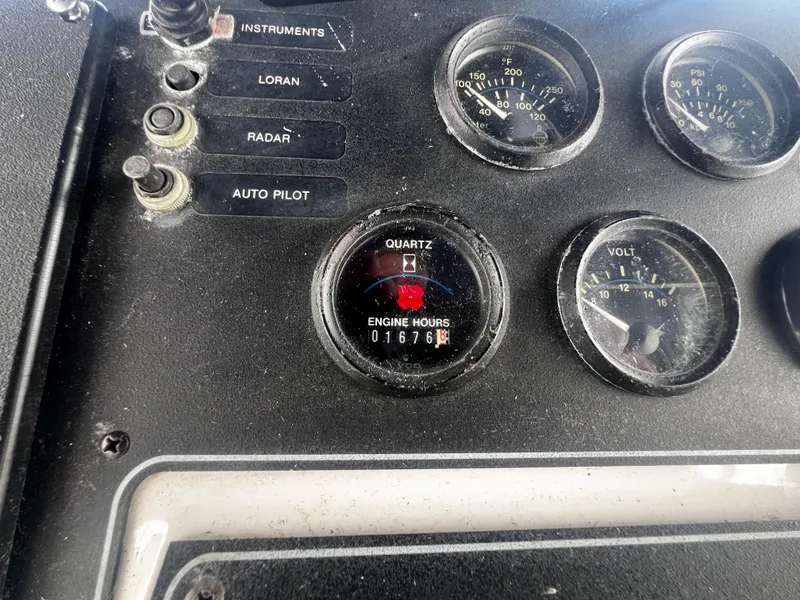 Slide: The Image of Close-up of 1993 Carver 350 Aft Cabin boat dashboard with engine hours gauge. - 14