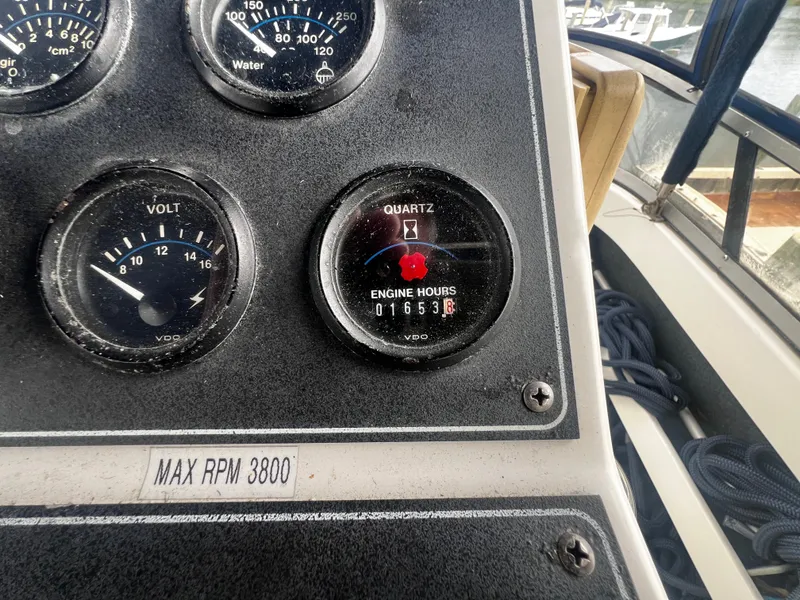 Slide: The Image of Close-up of 1993 Carver 350 Aft Cabin engine hour meter and gauges. - 15