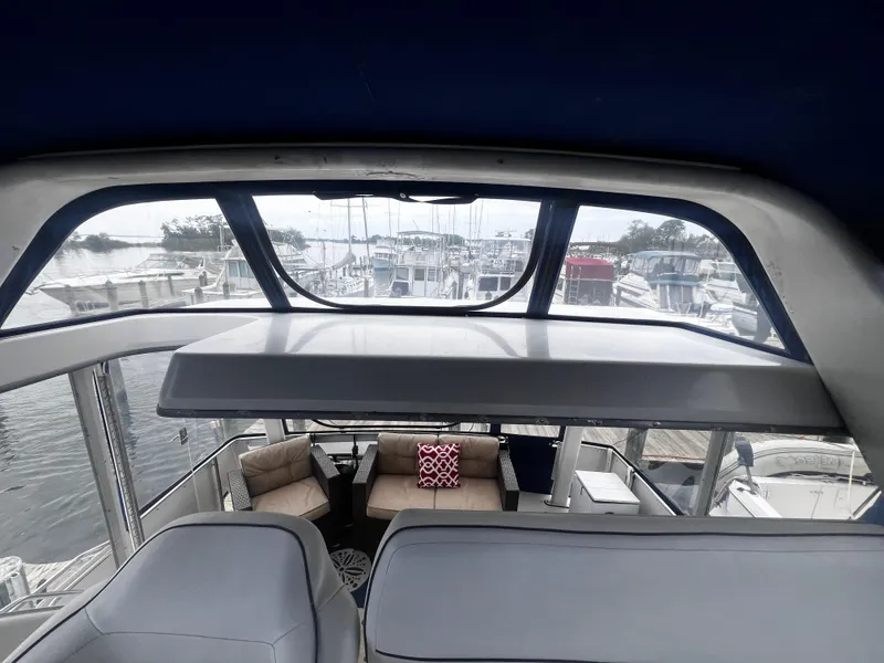 Slide: The Image of Interior view of 1993 Carver 350 Aft Cabin yacht at marina. - 17